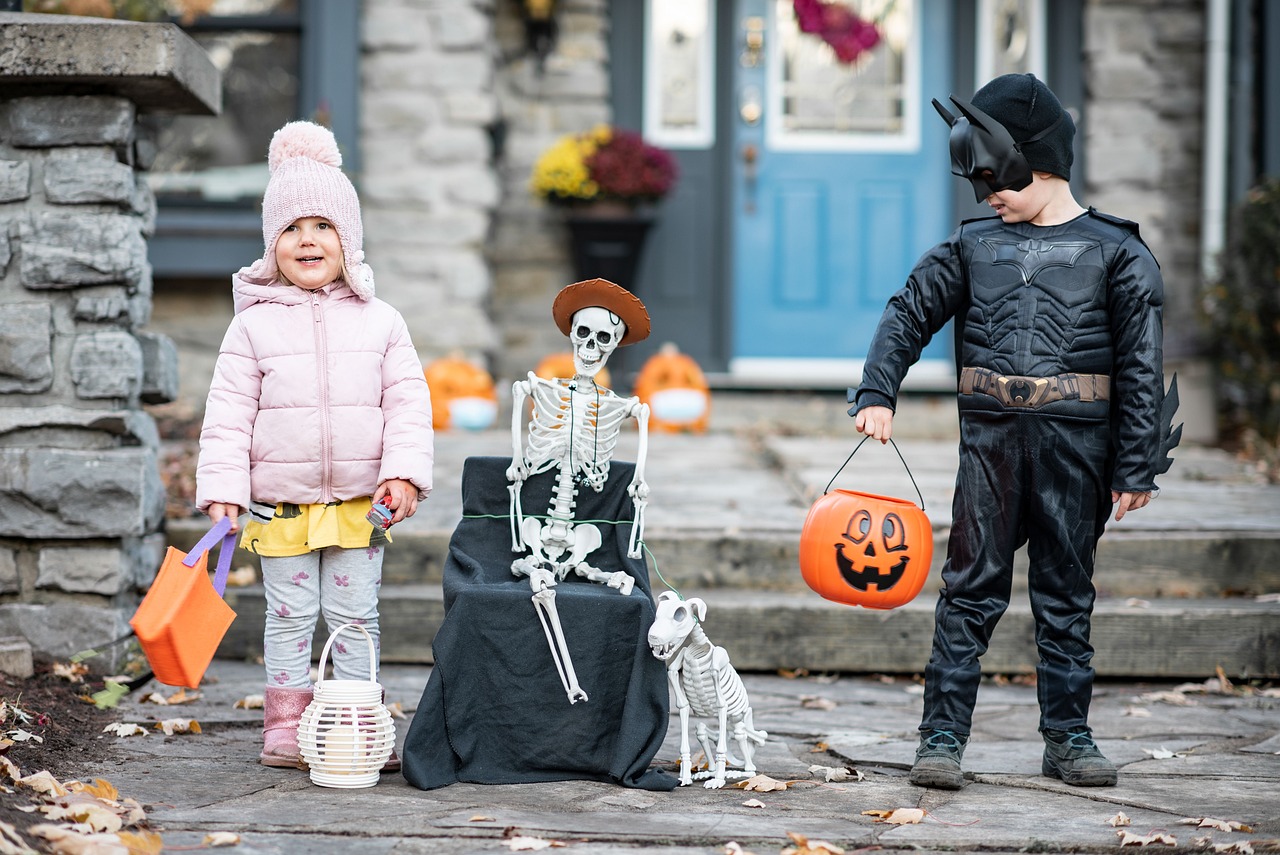 Young siblings ready to go out trick-or-treating on Halloween